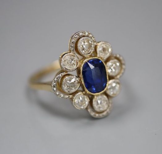 An early to mid 20th century 18ct, sapphire and diamond set quatrefoil cluster ring, size L, gross 3.2 grams.